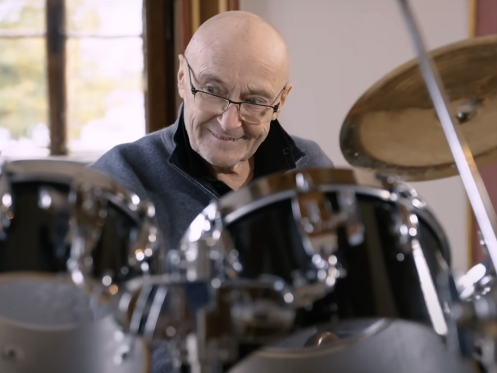 watch-phil-collins-sit-down-at-drum-set-for-first-time-in-years